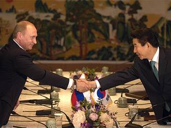 Владимир Путин и президент Республики Корея Но Му Хен, фото пресс-службы президента России Владимир Путин и президент Республики Корея Но Му Хен, фото пресс-службы президента России