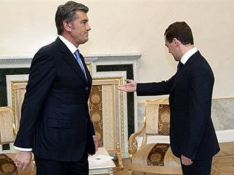 Виктор Ющенко и Дмитрий Медведев. Фото AFP 