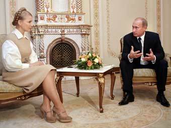 Юлия Тимошенко и Владимир Путин на встрече в Москве. Фото AFP