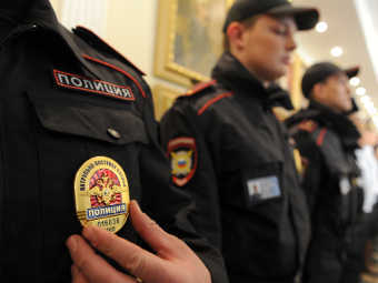 Нагрудный знак сотрудника полиции. Фото РИА, Алексей Филиппов